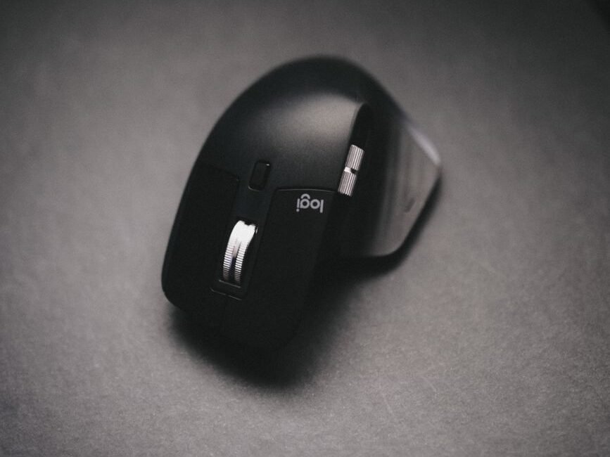 photograph of a black wireless mouse