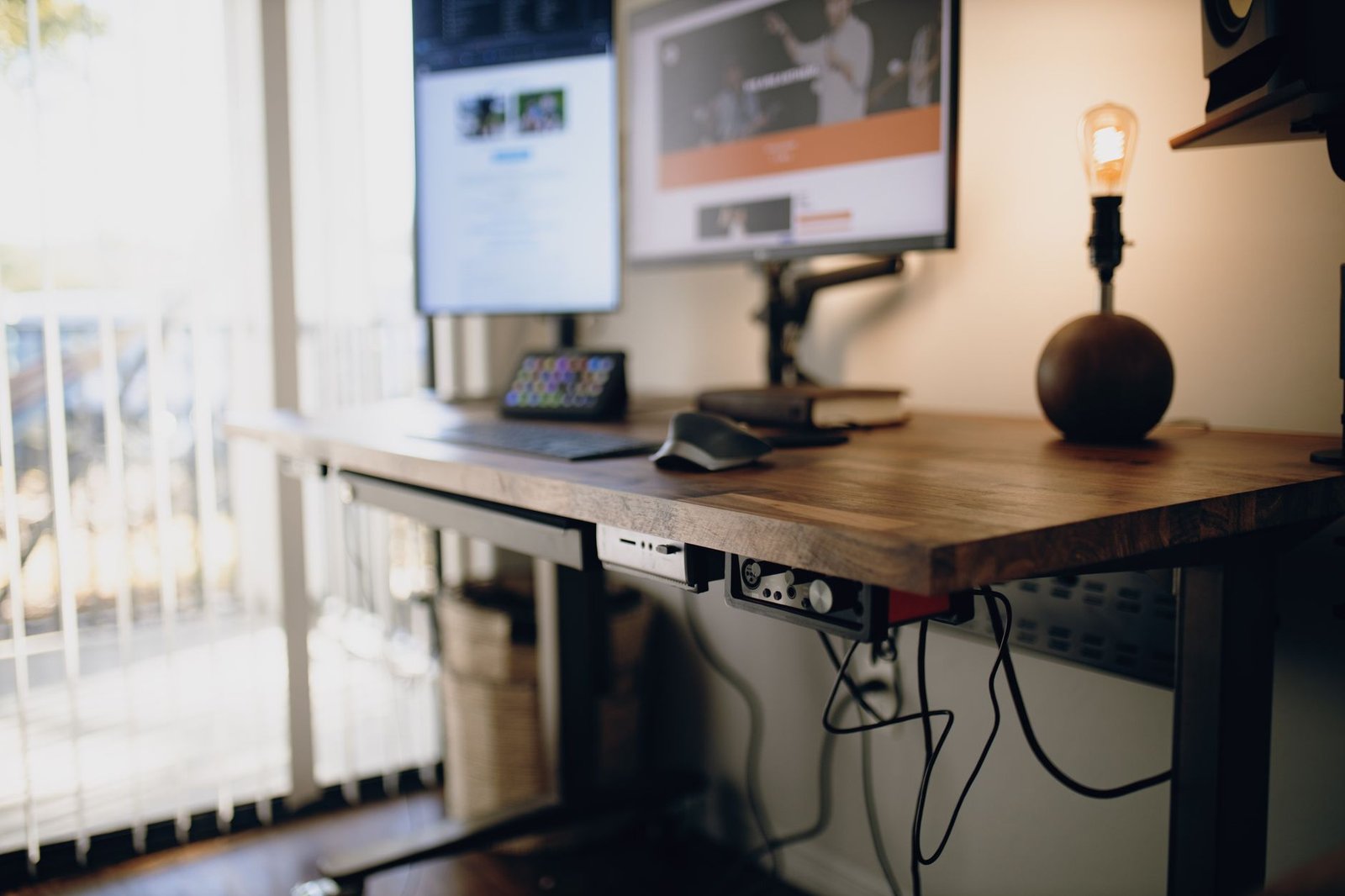 a standing desk with a computer